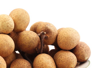 Fresh longan fruit placed on white background, isolated.