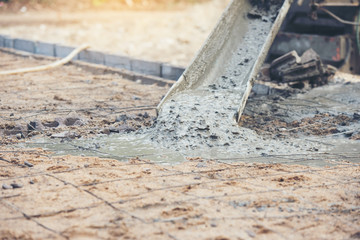 Fototapeta premium Concrete cement pouring during commercial concreting floors of building