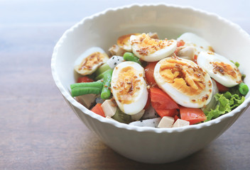Diet menu. Healthy salad of fresh vegetables and egg on a bowl