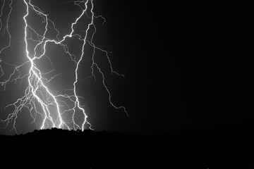 Nature lightning bolt at night thunder storm sea near