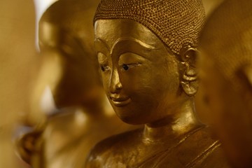 Ordained female monks or Bhikkunis surround Buddha's sculpture.These are some of the oldest and...
