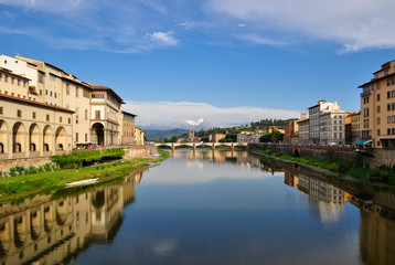 View of Arno river in Florence, Tuscany, Italy, from Ponte Vecchio. The bridge in the distance is Ponte alle Grazie