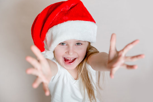 Little girl in red santa's hat