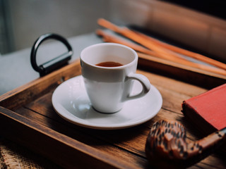 Close up hot coffee on wooden background.