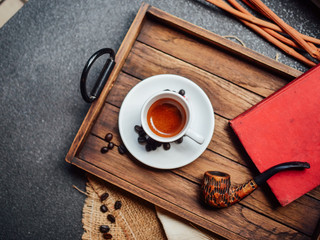 Close up hot coffee on wooden background.