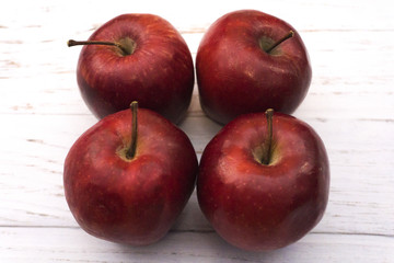 Close up of red apples on white background table 