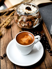 Close up hot coffee on wooden background.
