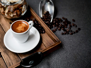 Close up hot coffee on wooden background.
