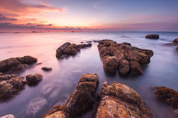 Fototapeta na wymiar view of beautiful sunset seascape at Kudat, Malaysia. soft focus due to long expose.
