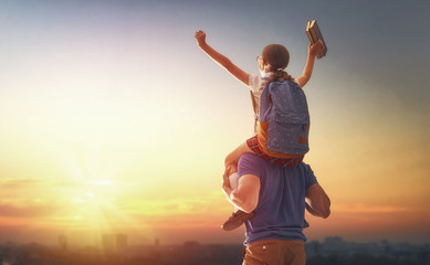 Man and girl with backpack
