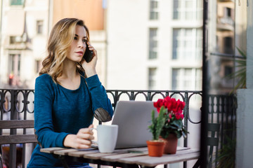 Girl working on the balcony