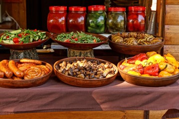 food and dishes in brown plates on the table