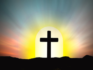 Silhouettes of crucifix symbol with bright sunbeam