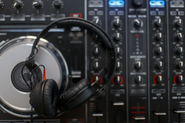 Stylish DJ headphones and mixing console top view