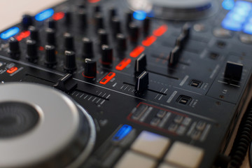 Black audio controller. DJ mixing console