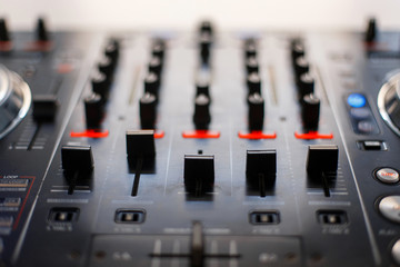 Audio mixing console. Reduction of music. DJ instrument