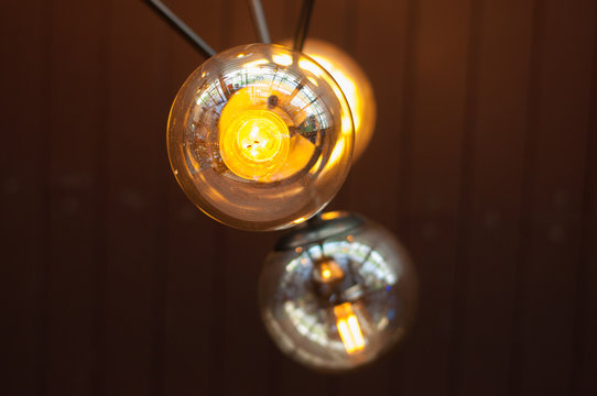 lamp lightbulbs reflecting of people
