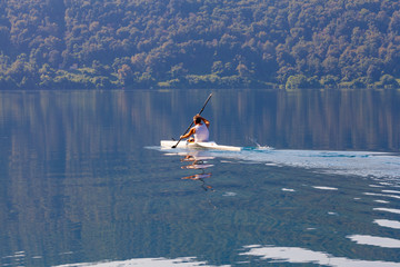 man canoeing on the lake