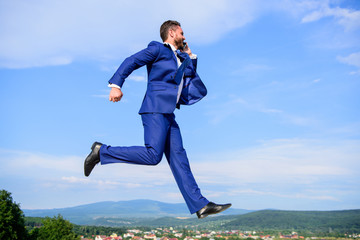 Never stop. Businessman formal suit jump while call smartphone sky background. Entrepreneur in...