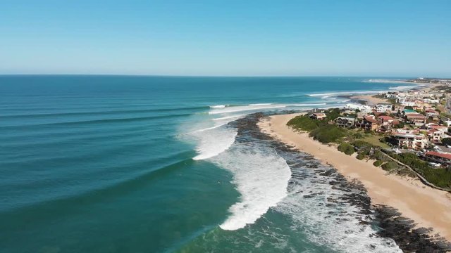 Aerial shot of surfers in Jeffreys Bay, South Africa