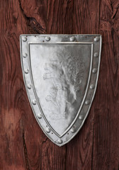 silver shield on a wooden background