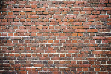 Old worn brick wall exterior pattern texture background