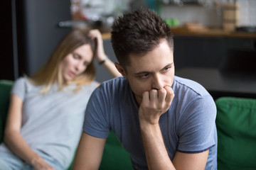 Upset frustrated boyfriend thinking of family conflicts after fight with girlfriend, sad thoughtful...
