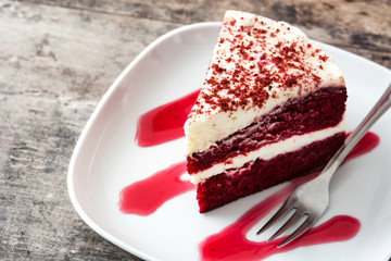 Red Velvet cake slice on wooden table