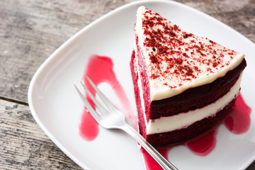 Red Velvet cake slice on wooden table