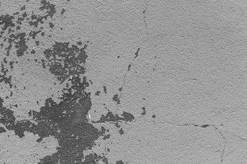 Wall fragment with scratches and cracks