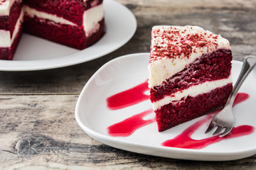 Red Velvet cake slice on wooden table