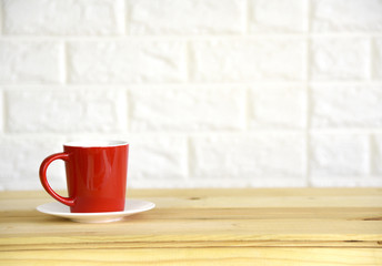 Red Coffee Cup on Wooden Table,Copy space.