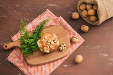 Tasty homemade walnut muffins on table. Sweet pastries