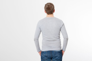 Young man wearing blank t-shirt isolated on white background. Copy space. Place for advertisement. Back view. Mock up. Template shirt