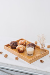 Breakfast with fresh homemade delicious muffins and milk.