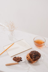 Breakfast with fresh homemade delicious muffins and tea.