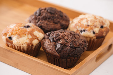 Dellicious homemade muffins on table. Sweet pastries