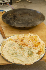 Preparation of Asian baking in a large black pan