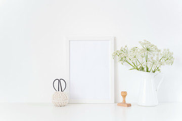 Vintage white frame mock up with herbal in jug,stamp.Mockup for design.Template for businesses,lifestyle bloggers, media