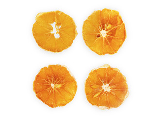 four dried slices of orange isolated on white background