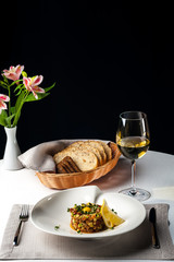 Salted tartar dish in the restaurant a white wine table