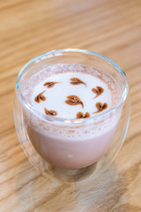 A glass of chocolate with mini heart shape