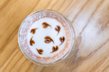 A glass of chocolate with mini heart shape