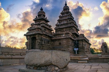 Photo shot on sunrise time where the historical buildings of Mamallapuram monuments are highlighted. 