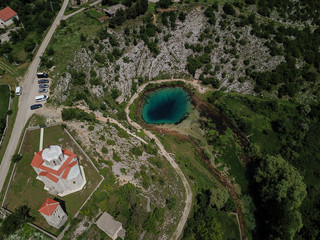 The spring of the Cetina River (izvor Cetine) in the foothills of the Dinara Mountain is named Blue Eye (Modro oko). Cristal clear waters emerge on the surface from a more than 100 meter-deep cave.