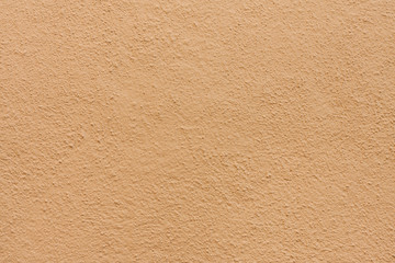 Stucco wall - Brown beige stucco textured wall background with natural light.