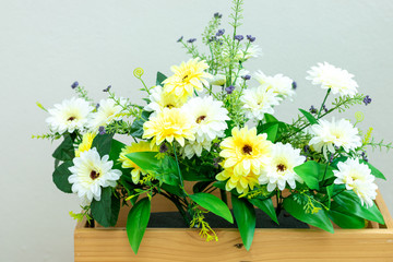 Flowers in a wooden crate for home decoration.