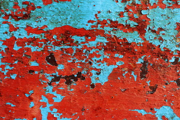 Metal surface painted with blue rust.