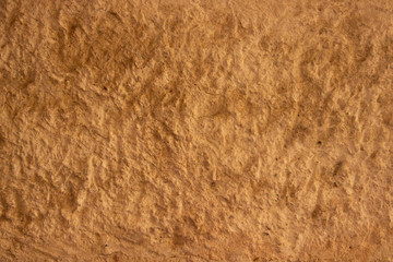 Stone textured wall of gray yellow tones
