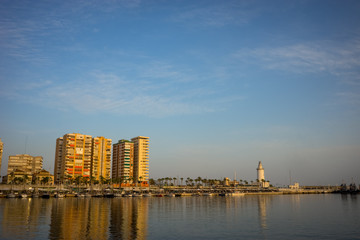 Plakat Spain, Malaga, a light house at the quay bay area